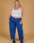 Juliet is wearing Baggy Mid-Rise Trousers in Royal Blue and vintage tee white Cropped Tank