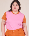 Ashley is 5’7” and wearing L Mismatched Tee in Pink & Orange