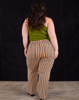 Back view of Work Pants in Autumn Stripe and summer olive Racerback Tank on Ashley