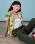 Alex is wearing Pantry Button-Up in Ocean and Sky and swamp green Work Pants