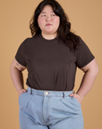 Ashley is wearing Organic Vintage Tee in Espresso Brown tucked into light wash Indigo Wide Leg Trousers