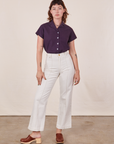 Alex is wearing Pantry Button-Up in Nebula Purple tucked into vintage tee off-white Western Pants