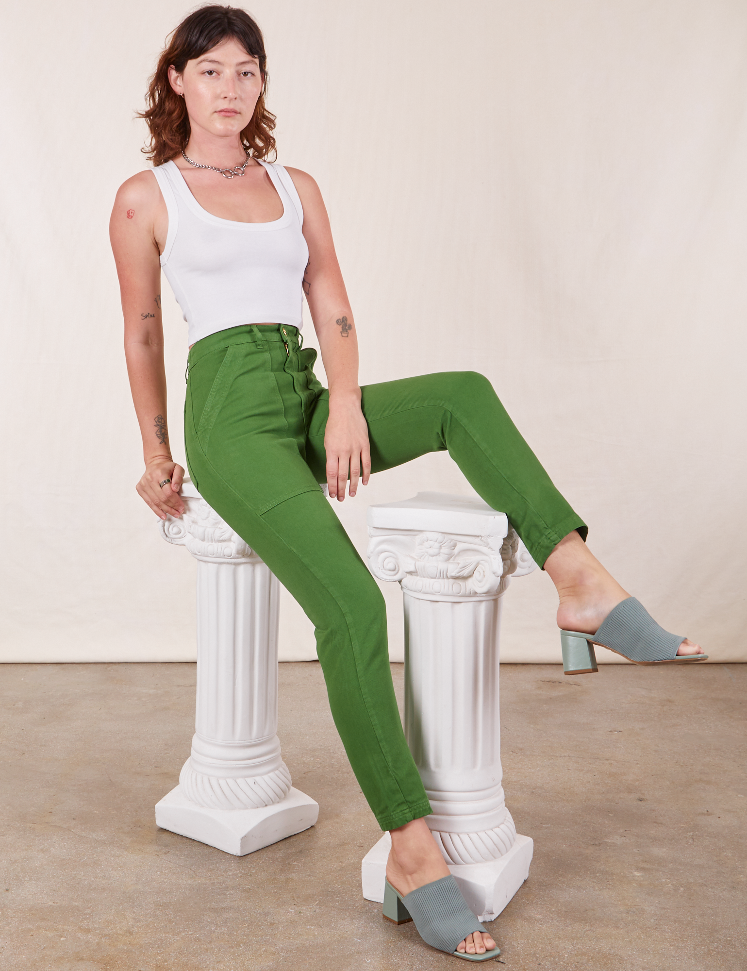 Alex is wearing Pencil Pants in Lawn Green and Cropped Tank Top in vintage tee off-white 