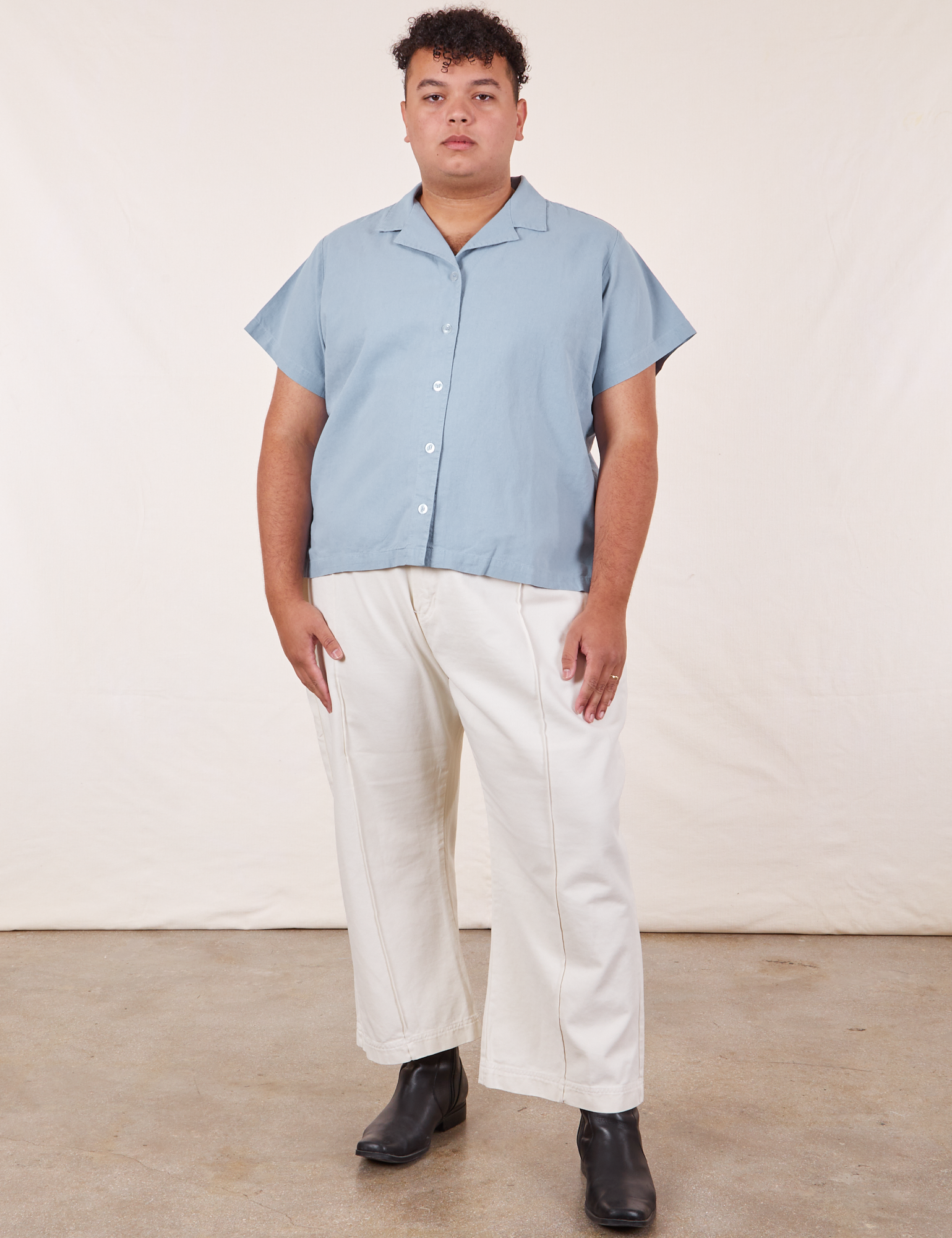 Miguel is wearing Pantry Button-Up in Periwinkle and vintage tee off-white Western Pants