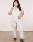 Ashley is 5’7” and wearing 1XL Petite  Short Sleeve Jumpsuit in Vintage Tee Off-White