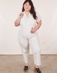 Ashley is 5’7” and wearing 1XL Petite Short Sleeve Jumpsuit in Vintage Tee Off-White