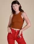 Alex is 5’8” and wearing P Racerback Tank in Burnt Terracotta