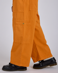 Drop Pocket Cargo Pants in Creamsicle Orange side pant leg close up on Isaac