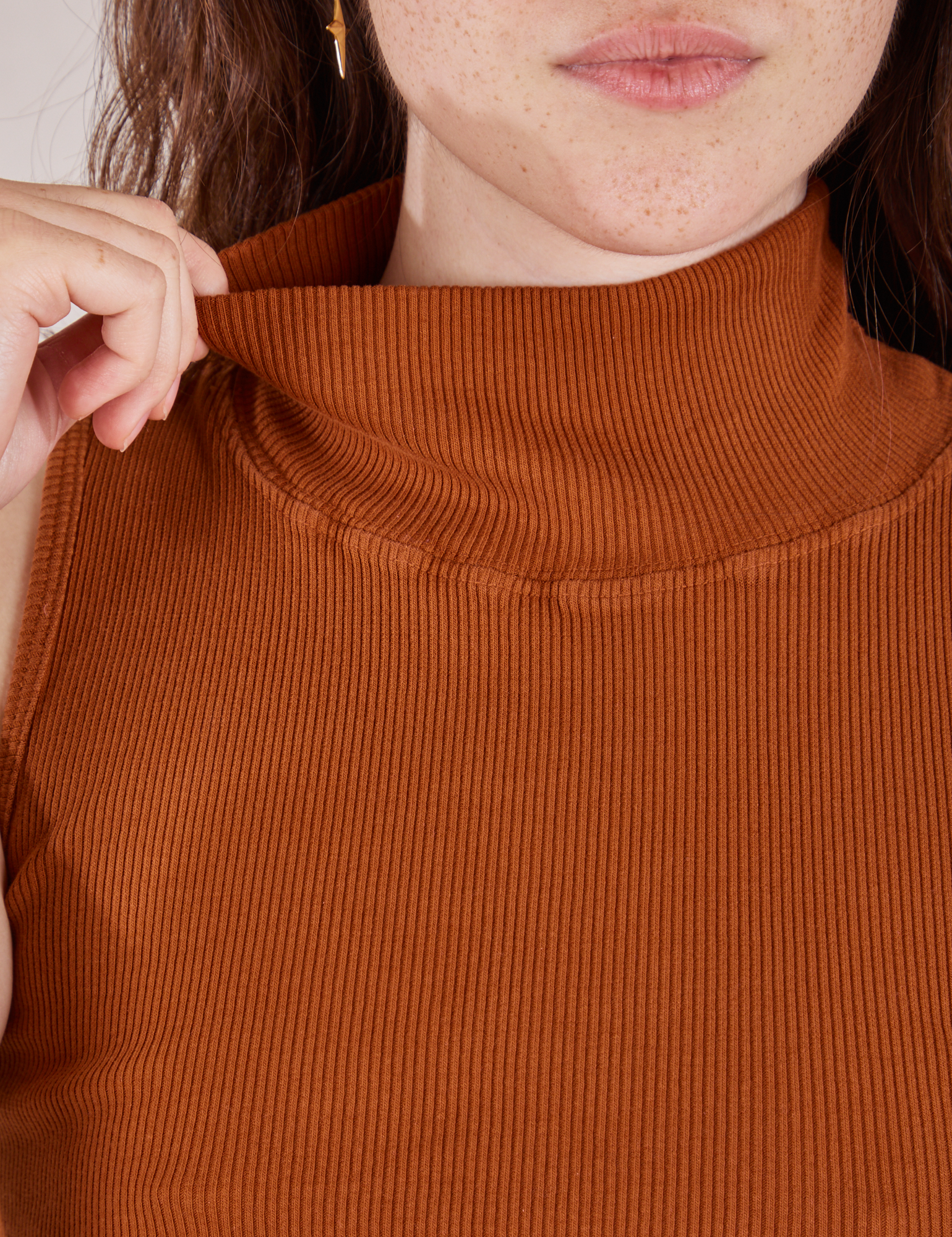 Sleeveless Essential Turtleneck in Burnt Terracotta front close up on Hana