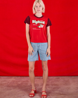 Madeline is wearing Vintage Tee in Cherry Soda and light wash Carpenter Shorts
