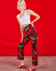 Side view of Paintstamped Work Pants in Cherry and Cropped Tank in vintage tee off-white on Madeline