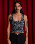 Anthony is 5'6" and wearing S Cropped Tank Top in Spider Webs