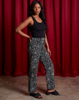Side view of Work Pants in Spiderwebs and black Cropped Tank on Kandia