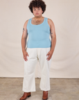 Miguel is wearing Tank Top in Baby Blue paired with vintage tee off-white Western Pants