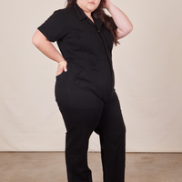 Side view of Short Sleeve Jumpsuit in Basic Black worn by Ashley