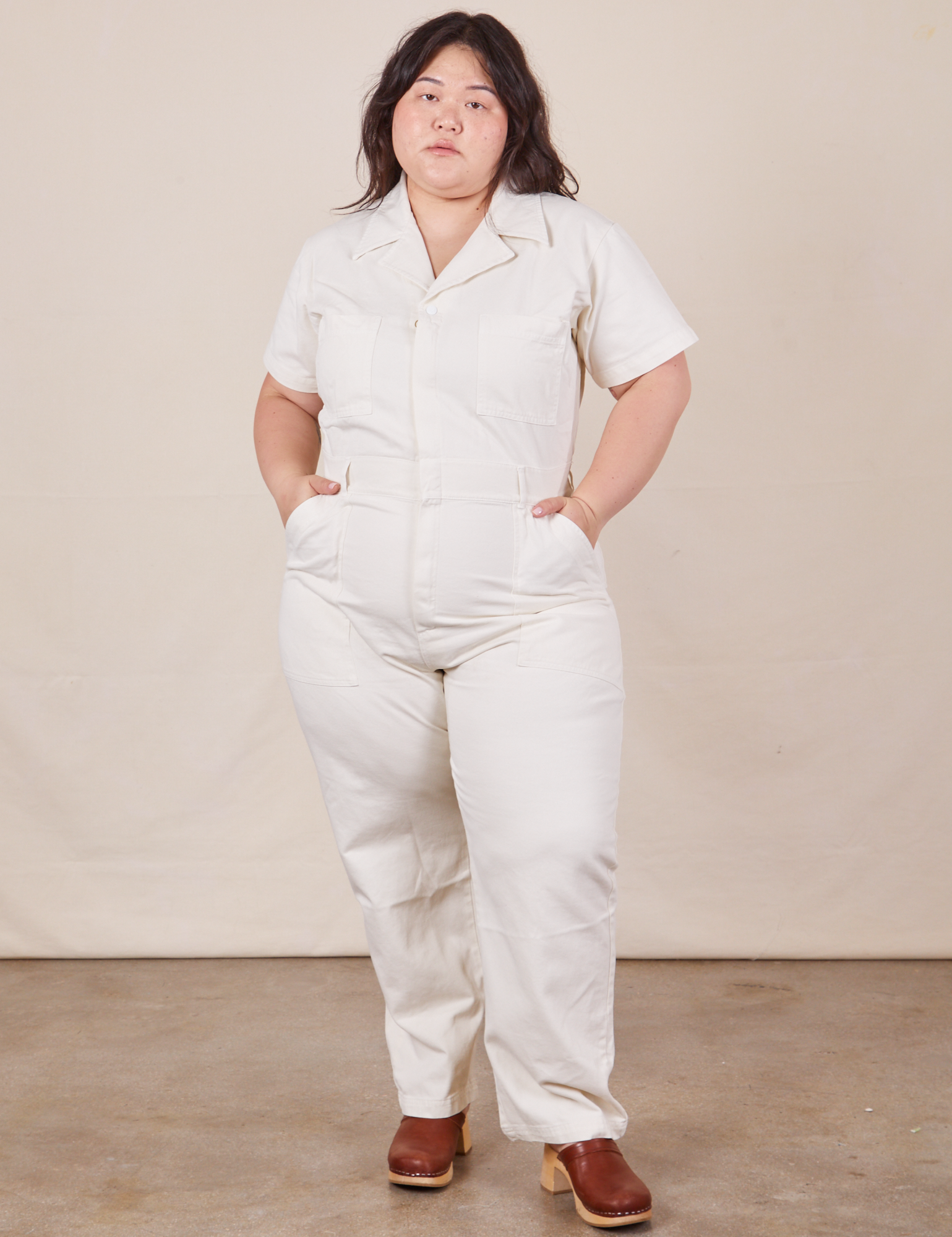 Ashley is 5'7" and wearing 1XL Short Sleeve Jumpsuit in Vintage Tee Off-White