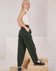 Side view of Heavyweight Trousers in Swamp Green and vintage tee off-white Sleeveless Turtleneck on Madeline