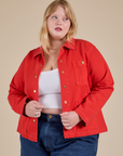 Juliet is 5'8" and wearing L Denim Work Jacket in Mustang Red