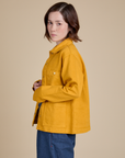 Side view of Denim Work Jacket in Mustard Yellow on Hana