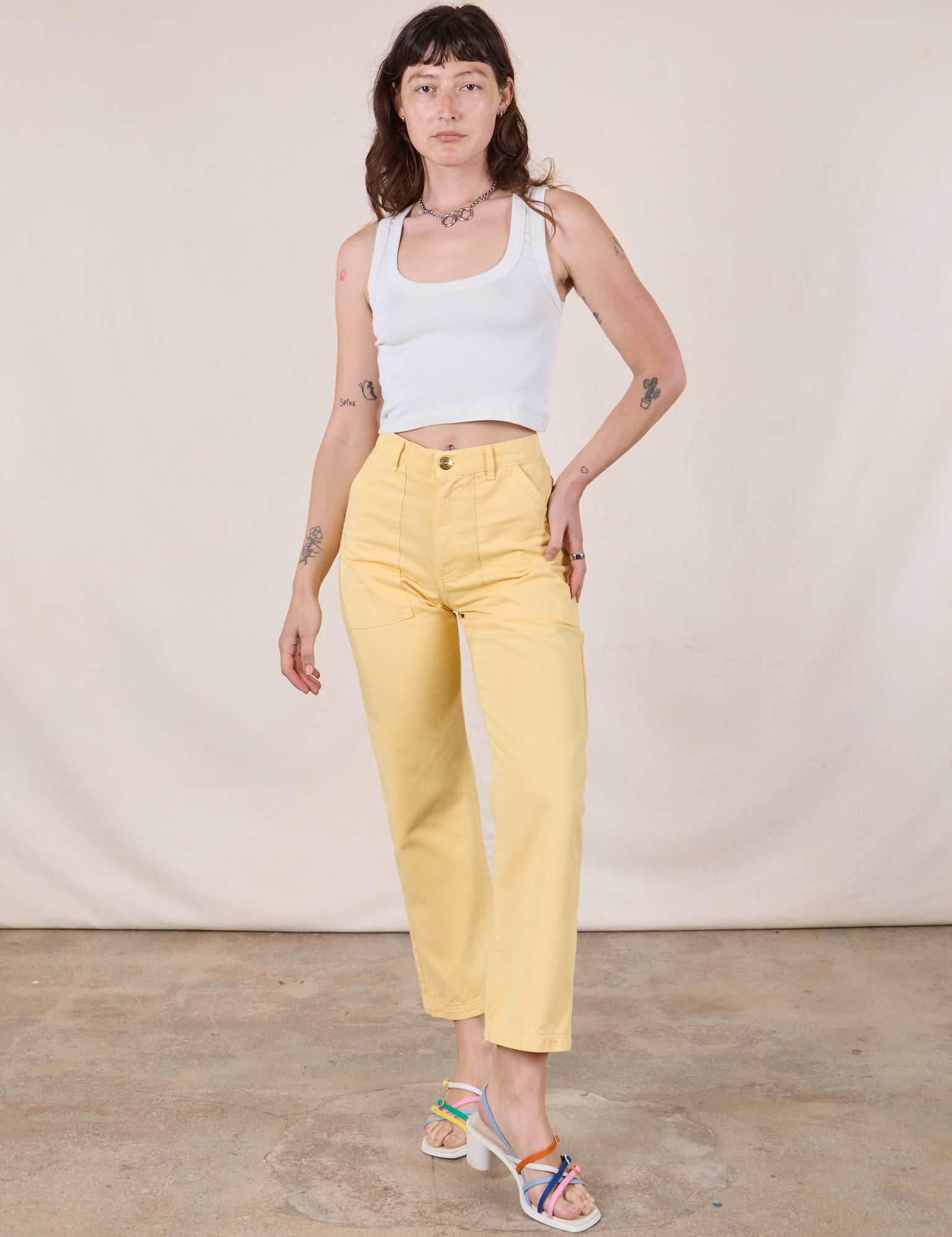 Work Pants in Butter Yellow and Cropped Tank in vintage tee off-white on Alex