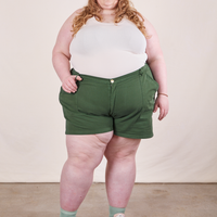 Catie is 5'11" and wearing size 5XL Classic Work Shorts in Dark Emerald Green paired with vintage off-white Tank Top