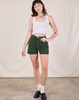 Alex is wearing Classic Work Shorts in Swamp Green and Cropped Tank in Vintage Tee Off-White