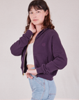 Side view of Cropped Zip Hoodie in Nebula Purple, vintage off-white Cropped Tank and light wash Carpenter Jeans