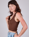 Cropped Tank Top in Fudgesicle Brown side view on Alex pulling on one of the straps