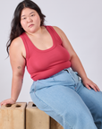 Ashley is wearing Cropped Tank Top in Hot Pink and light wash Wide Leg Trousers
