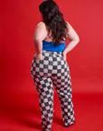 Back view of Checkerboard Work Pants in Black/White and halter top Royal Blue on Ashley