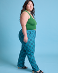 Side view of Checkerboard Work Pants in Blues and lawn green Cropped Tank on Ashley