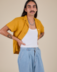 Angled front view of Pantry Button-Up in Mustard Yellow on Anthony