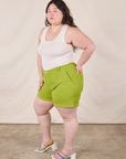 Side view of Classic Work Shorts in Gross Green and Tank Top in Vintage Tee Off-White on Ashley