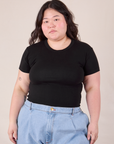Ashley is wearing Baby Tee in Vintage Basic Black tucked into light wash Denim Trousers