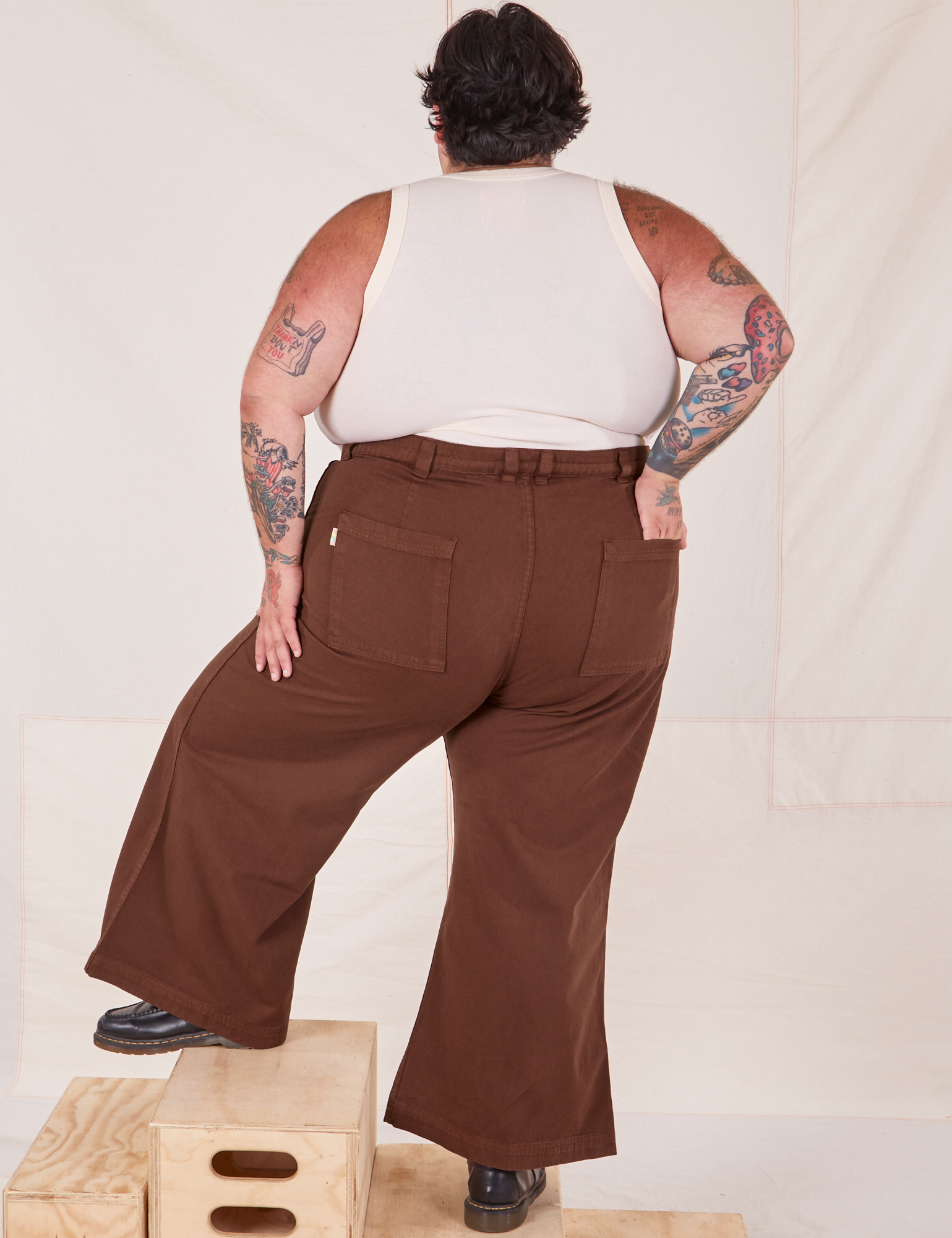 Back view of Bell Bottoms in Fudgesicle Brown and vintage off-white Cropped Tank Top on Sam