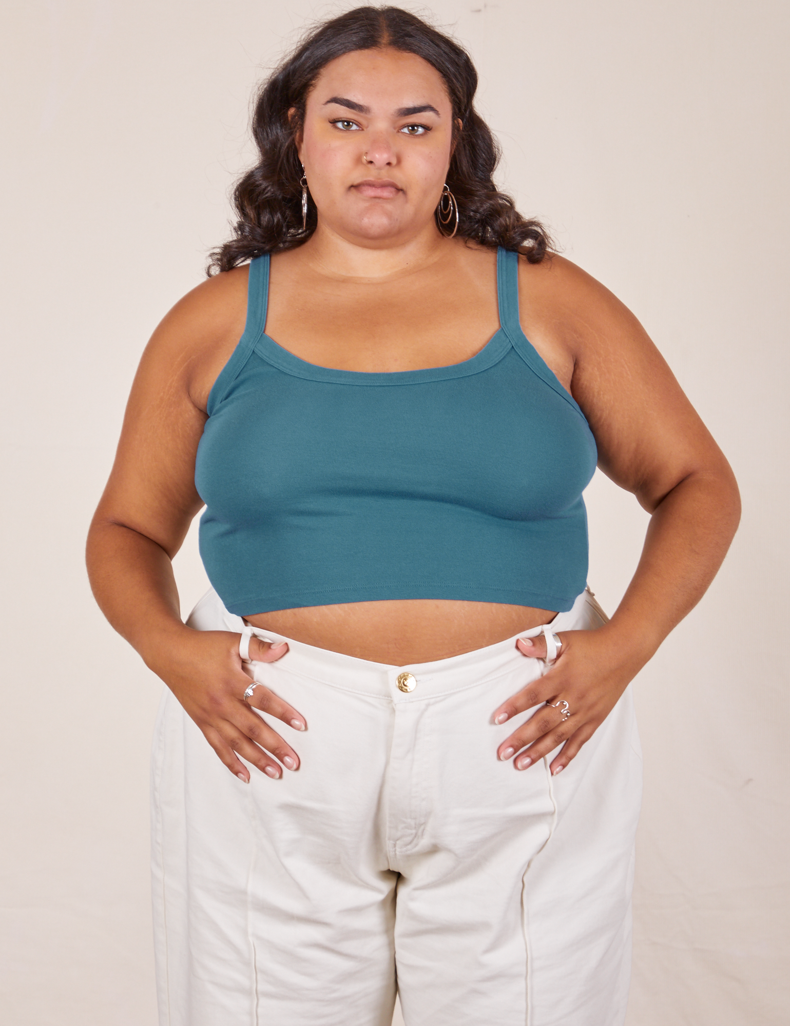 Alicia is 5&#39;9&quot; and wearing XL Cropped Cami in Marine Blue paired with vintage off-white Western Pants