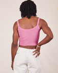 Back view of Cropped Cami in Bubblegum Pink and vintage tee off-white Western Pants worn by Jerrod