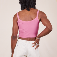 Back view of Cropped Cami in Bubblegum Pink and vintage off-white Western Pants worn by Jerrod