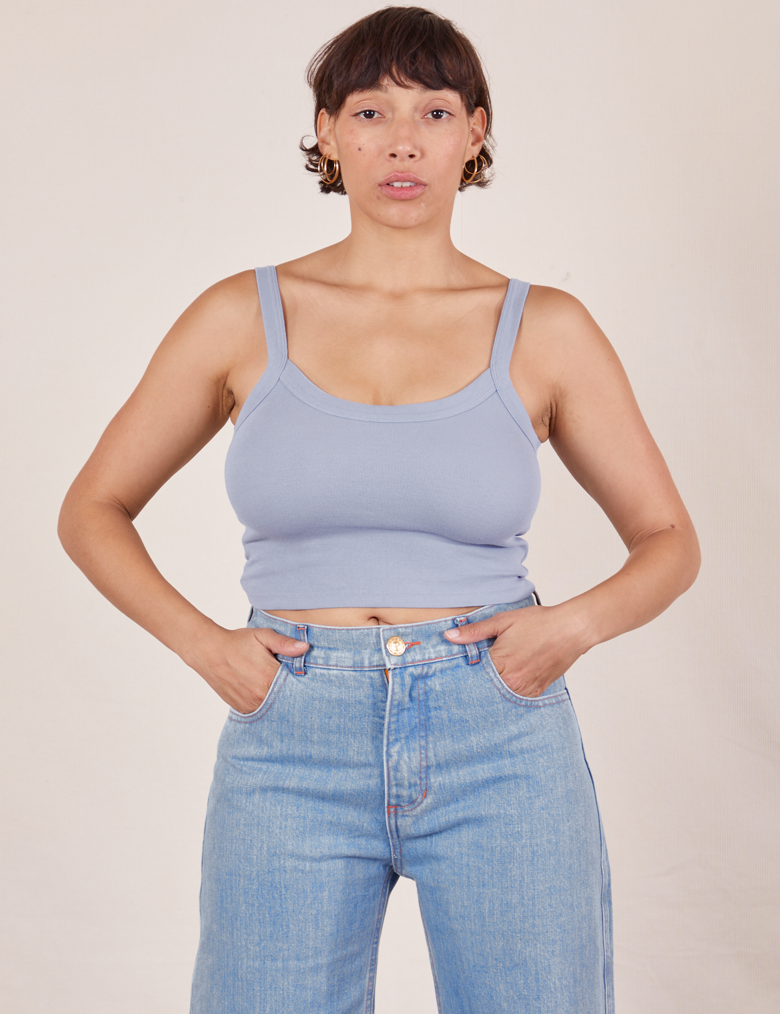 Tiara is 5&#39;4&quot; and wearing XS Cropped Cami in Periwinkle paired with light wash Sailor Jeans