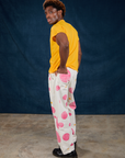 Side view of Paintstamped Work Pants in Bubblegum and sunshine yellow Organic Vintage Tee