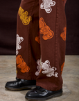 Gummy Bear Paintstamped Work Pants in Fudgesicle Brown pant leg close up on Isaac