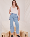 Allison is 5'10" and wearing S Carpenter Jeans in Light Wash paired with Tank Top in vintage tee off-white