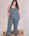 Ashley is 5'7" and wearing 1XL Carpenter Overalls in Railroad