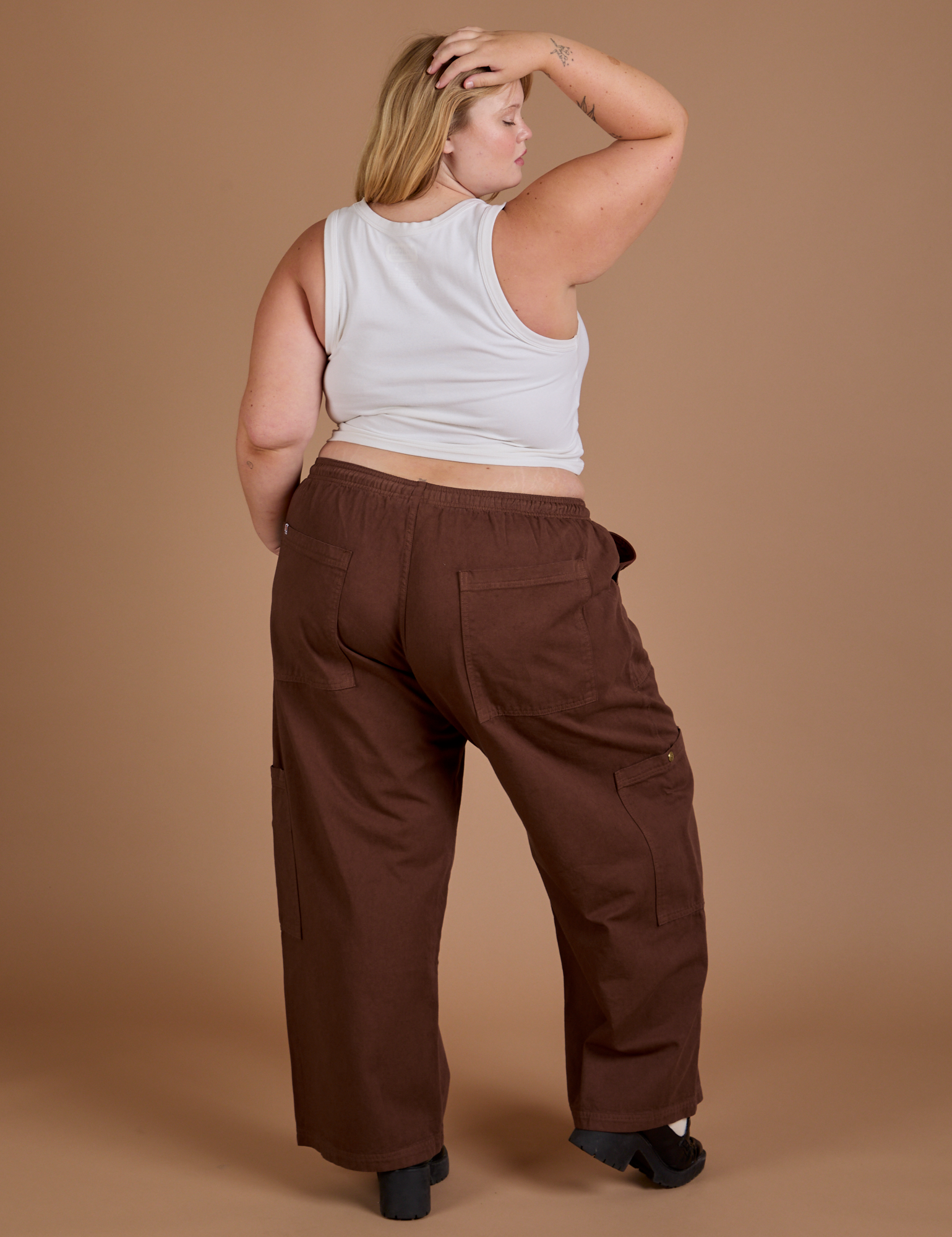 Back view of Drop Pocket Cargo Pants in Fudgesicle Brown and Cropped Tank in vintage tee white