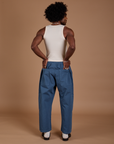 Back view of Drop Pocket Cargo Pants in French Blue and Tank Top in vintage tee white