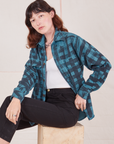 Alex is wearing Plaid Flannel Overshirt in Marine Blue and black Work Pants