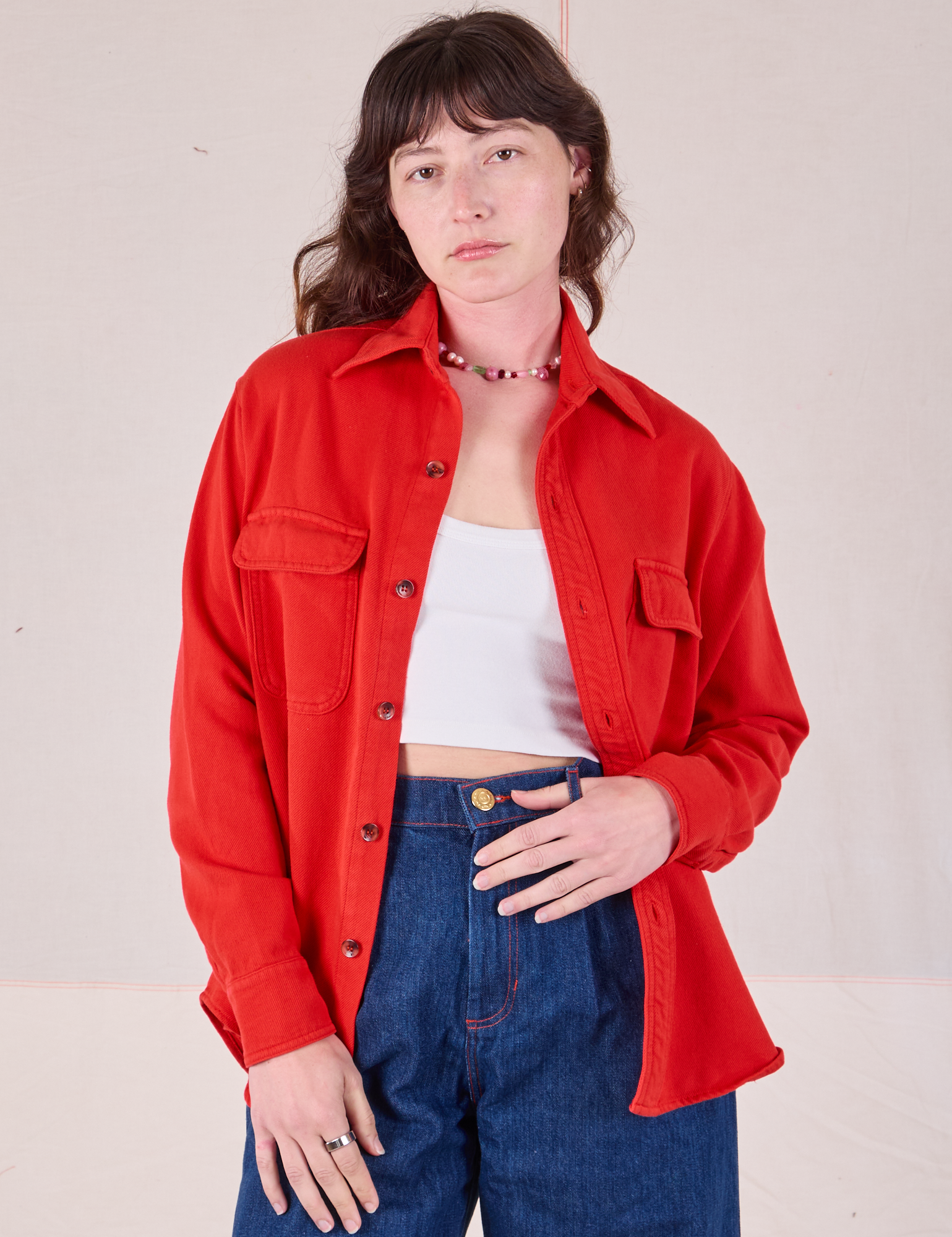 Alex is 5'8" and wearing P Flannel Overshirt in Mustang Red