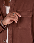 Flannel Overshirt in Fudgesicle Brown front pocket close up on Isaac