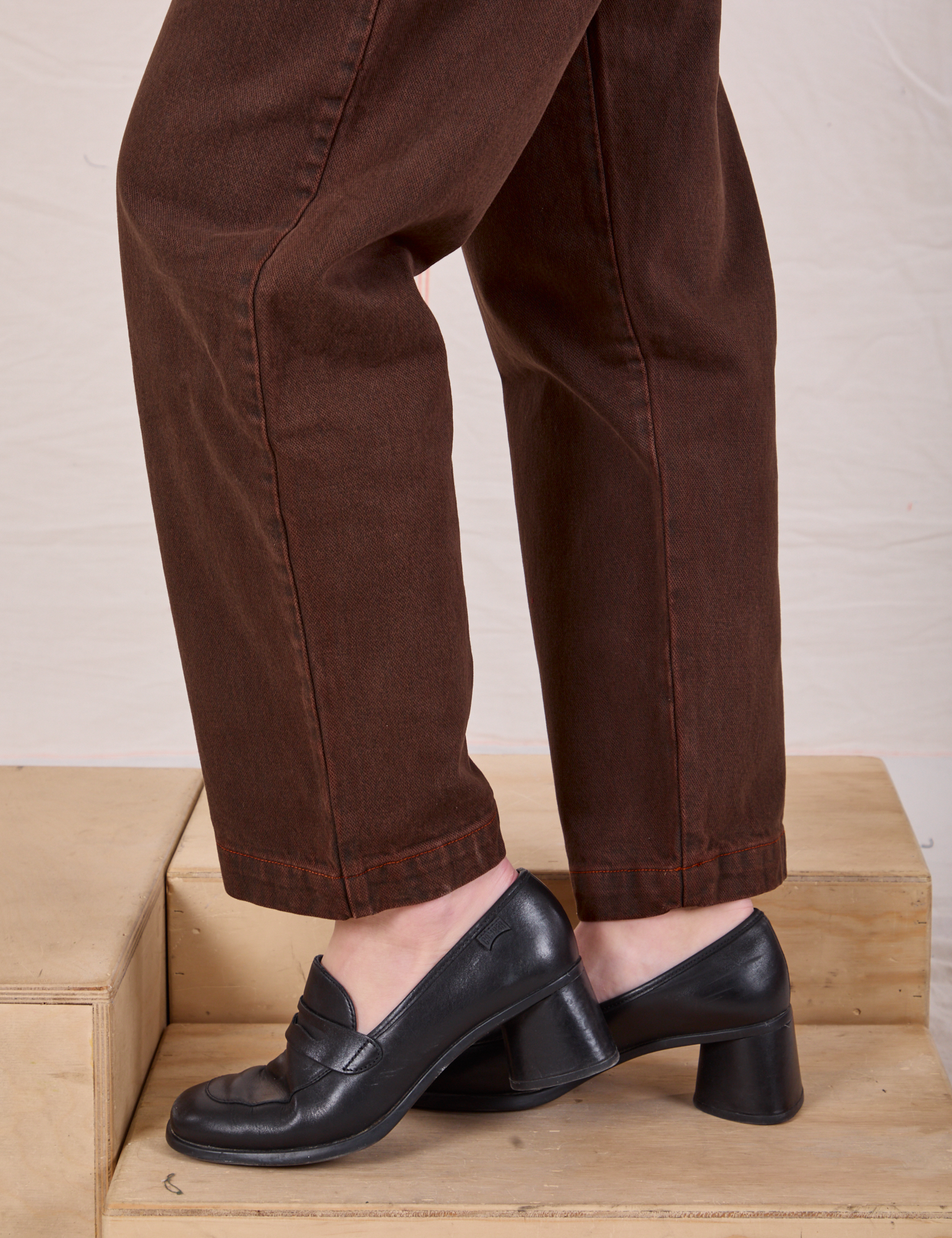 Overdyed Denim Trouser in Fudge pant leg close up on Alex