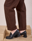 Overdyed Denim Trouser in Fudge pant leg close up on Alex